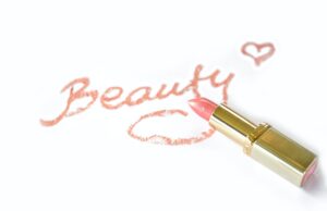 beauty written with pink lipstick
