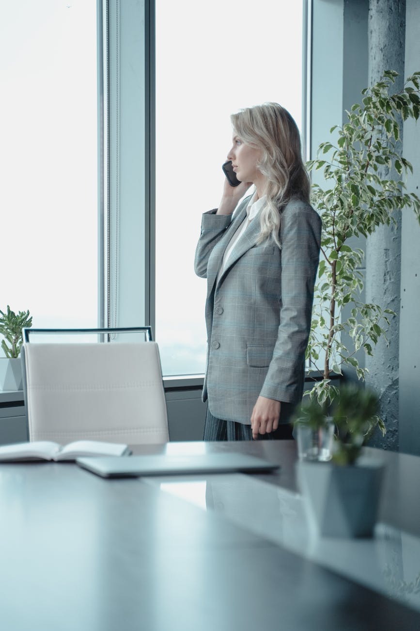 woman in gray blazer on the phone