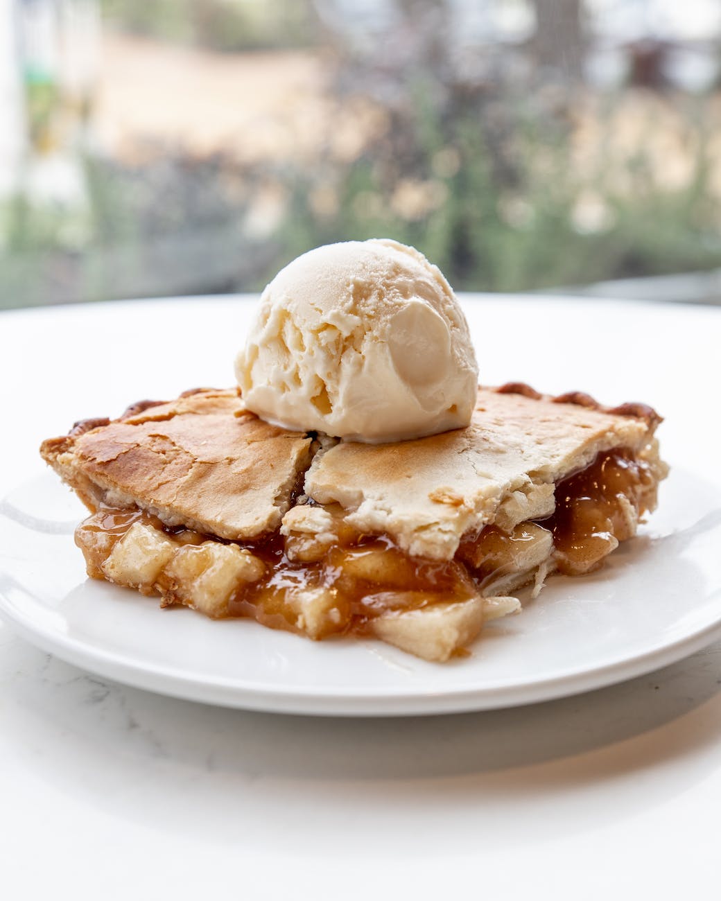 delicious ice cream on plate with apple pie