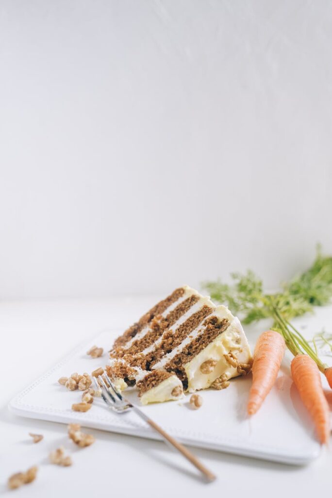 sliced carrot cake on a white plate