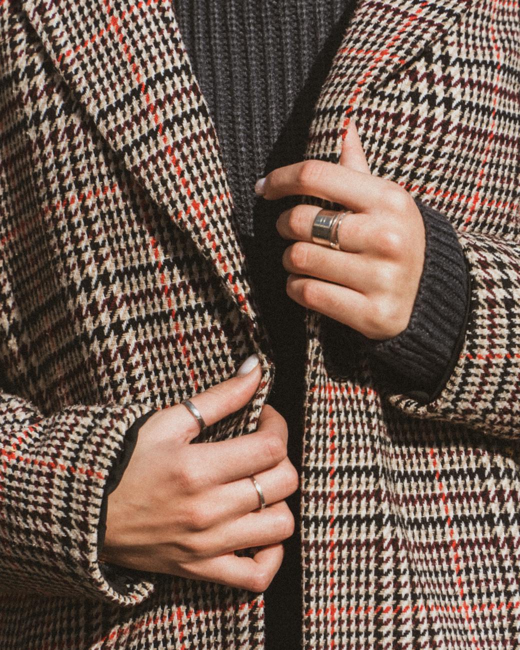 a person wearing a plaid jacket